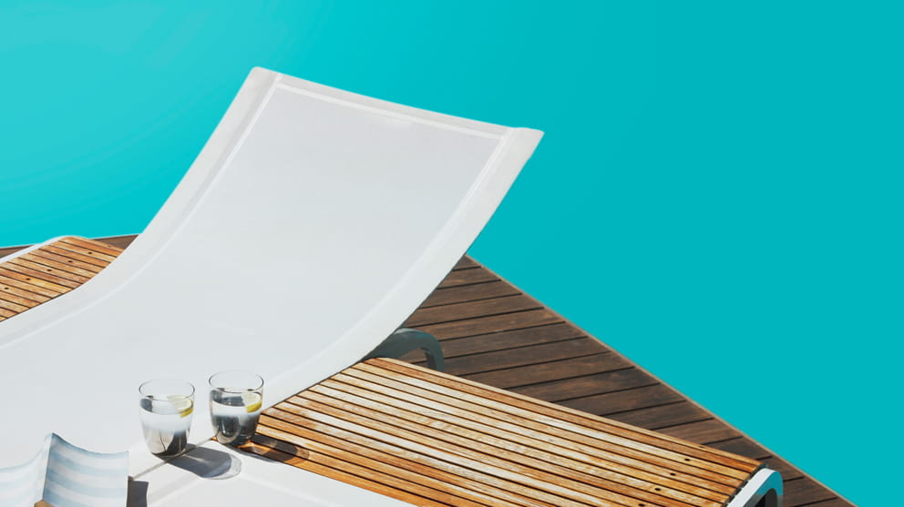 Sun lounger with blue background