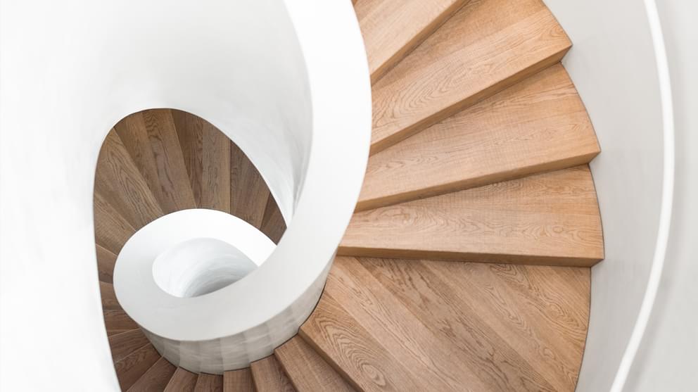 Top view spiral staircase white and wooden