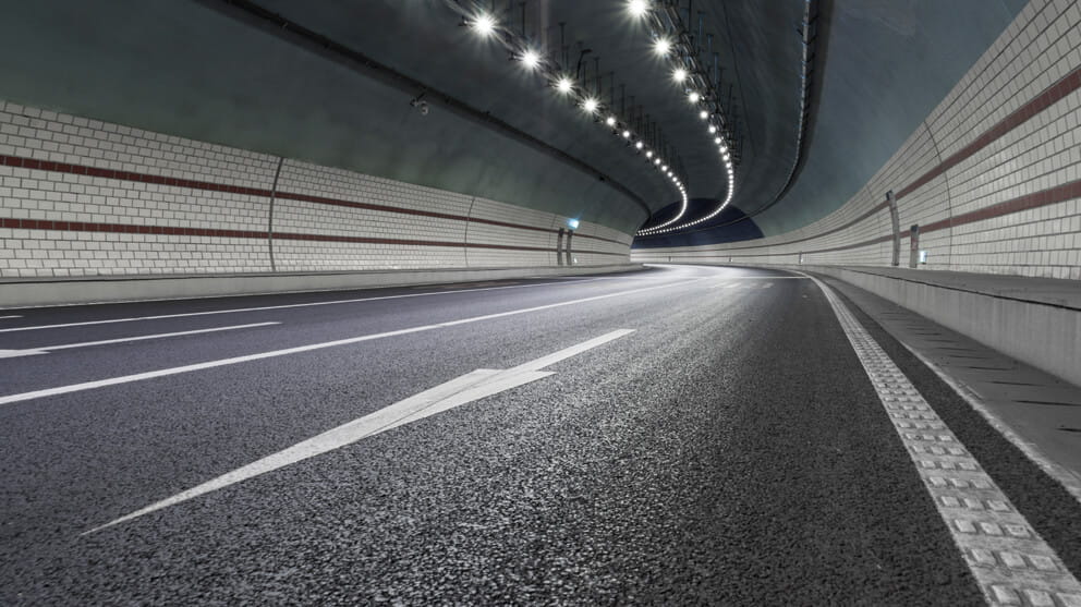 Road tunnel with lights alluminated