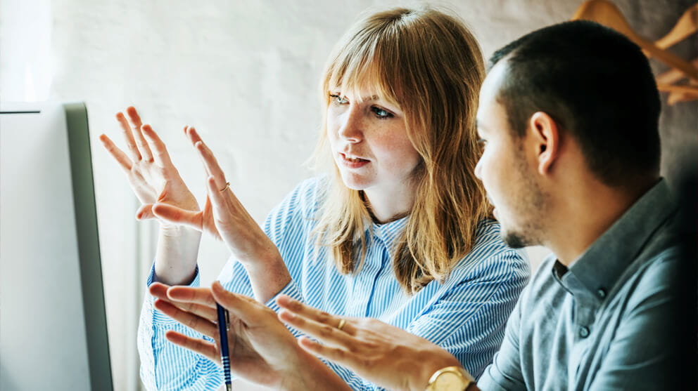 Colleagues at a computer working together
