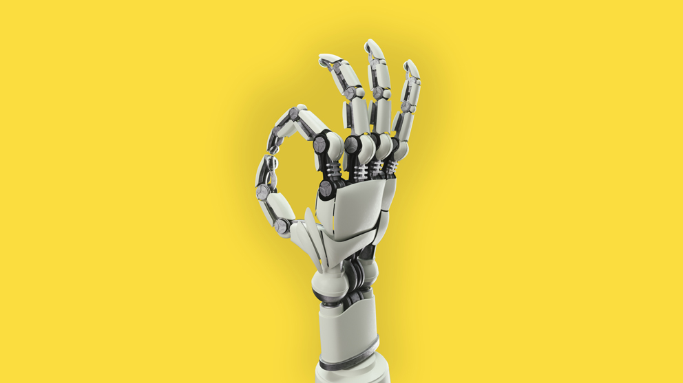 Robot hand on yellow bakground