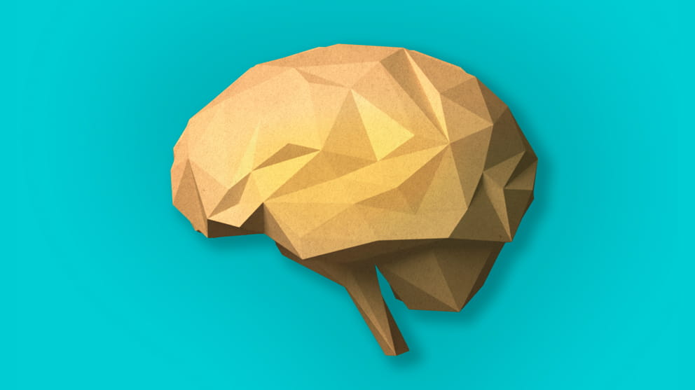 Paper craft brain on light blue background