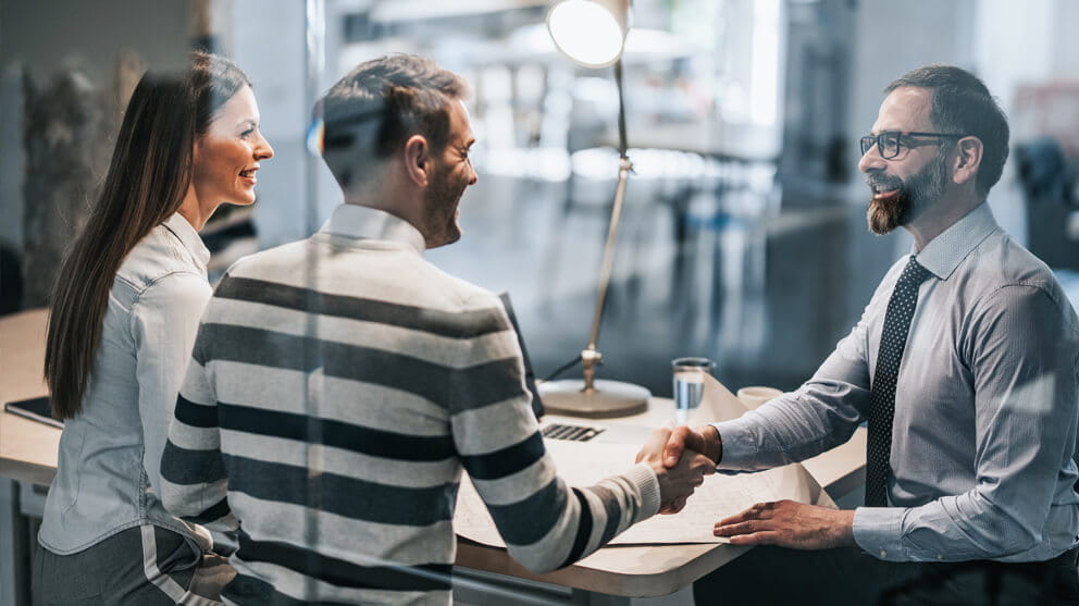 People shaking hands during a meeting