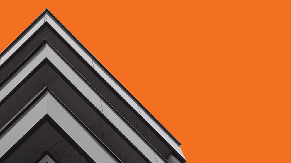Close up of a corner of a building, with orange background